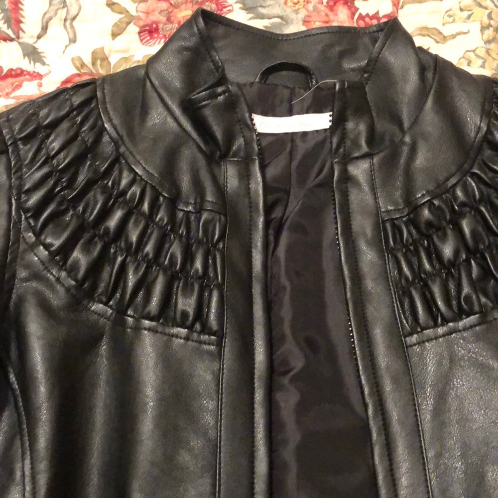 Like new pleather jacket. Cute design and work once.